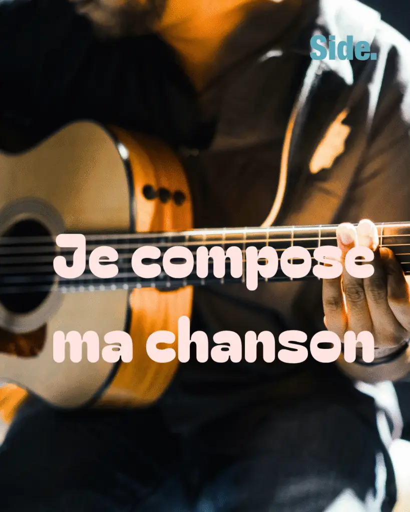 Une guitare avec écrit je compose ma chanson au dessus